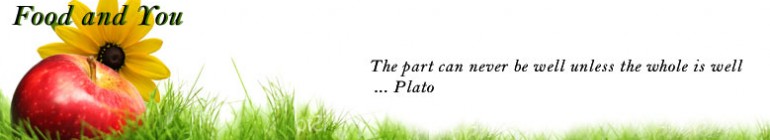 pic of an apple on grass with a lovely sun flower with a quote from Plato